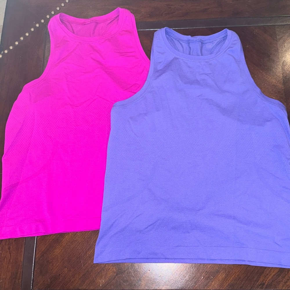 2 like new Swiftly High neck 2.0 race length tanks, size 8.